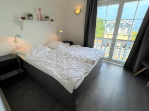 Postel nebo postele na pokoji v ubytování Strandpark Sierksdorf H080