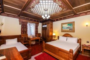 Postel nebo postele na pokoji v ubytování Brilant Antik Hotel