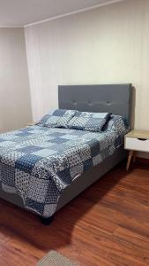 Giường trong phòng chung tại CONDOMINIO PANORAMIC