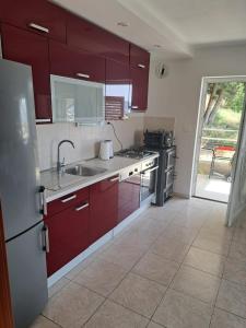 Kuchyň nebo kuchyňský kout v ubytování Apartments Granić