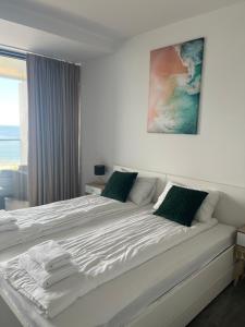 Ένα ή περισσότερα κρεβάτια σε δωμάτιο στο Apartament z widokiem