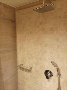 a shower in a bathroom with a shower head at Calm house in Sivros village, Lefkada in Sívros