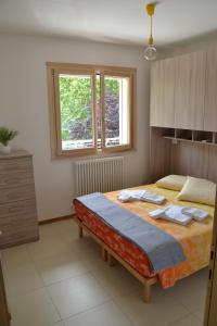 A bed or beds in a room at Il Terrazzo 40 metri dal mare