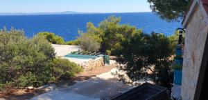 a view of the ocean from a house at Apartmani Kerum in Jelsa +4 photos