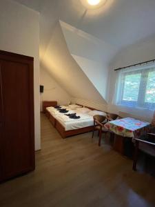 a bedroom with a large bed in a attic at Villa Dolce Vita in Mrzeżyno