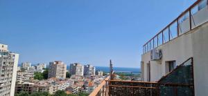 a view of a city from a balcony of a building at Студио Тони 2 с панорамна тераса и морска гледка Варна in Varna City