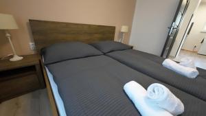 A bed or beds in a room at Apartmán Andrea