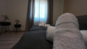 A bed or beds in a room at Apartmán Andrea
