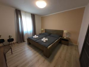 A bed or beds in a room at Apartmán Andrea
