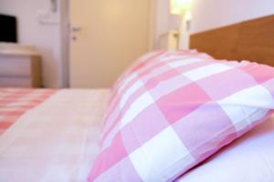 Postel nebo postele na pokoji v ubytování Hotel Kinda