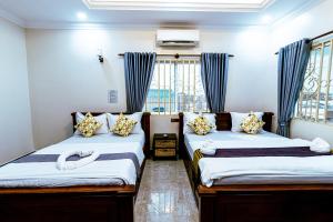 Postel nebo postele na pokoji v ubytování Seagull Guesthouse Kampot
