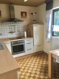 Kuchyň nebo kuchyňský kout v ubytování Gästehaus Nelles