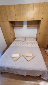 Postel nebo postele na pokoji v ubytování Sobe Biserka i Mario Brseč