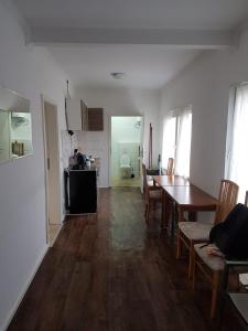 a kitchen and dining room with a table and chairs at ByTy 3 in Gransee