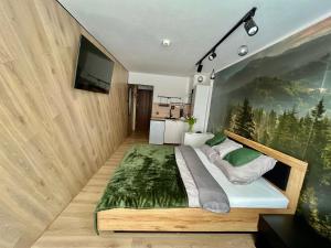 Postel nebo postele na pokoji v ubytování Ustroń Jaszowiec Apartament Basia