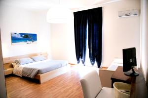 Postel nebo postele na pokoji v ubytování Hotel Kinda