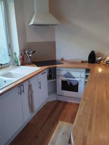 a kitchen with a counter top and a sink at gite au village in Mourvilles-Hautes