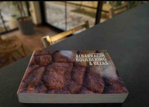 a book sitting on top of a table at Casa rural Hitohouse Bed&Climb in Albarracín +16 photos