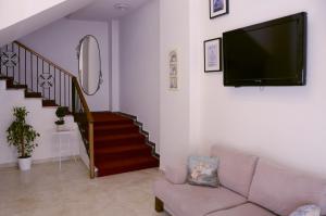 TV a/nebo společenská místnost v ubytování ParionHouse Hotel