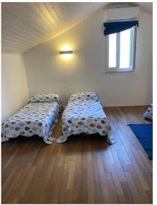 Postel nebo postele na pokoji v ubytování Casa in centro a Lussinpiccolo + 13 fotografií