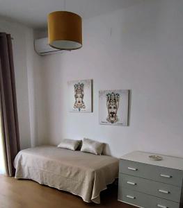 Ένα ή περισσότερα κρεβάτια σε δωμάτιο στο Domus i Mori di Santa Lucia del Mela