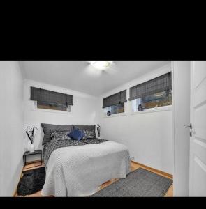 Postel nebo postele na pokoji v ubytování Northern Light Tromsø