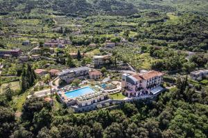 an aerial view of a mansion with a swimming pool at Natur Resort Panorama in Malcesine