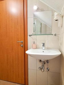 a bathroom with a sink and a mirror at B&B Villa Plitvica in Plitvica Selo +52 photos