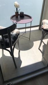 a table and a chair sitting on a balcony at Smart Residence in Baia Mare +15 photos