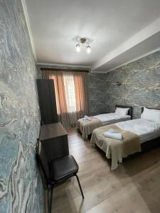 Rúm í herbergi á Hotel Shina