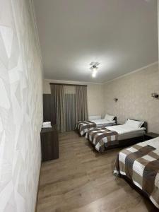 Rúm í herbergi á Hotel Shina