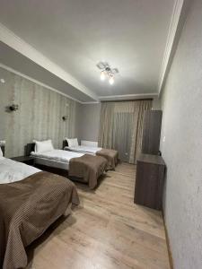 Rúm í herbergi á Hotel Shina