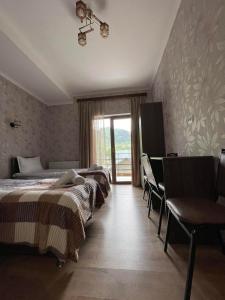 Rúm í herbergi á Hotel Shina