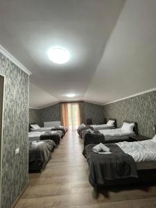 Rúm í herbergi á Hotel Shina