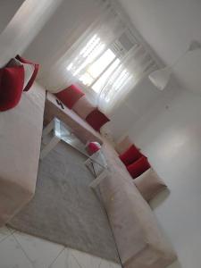 an attic view of a room with a window at perle de bouznika 15min walking to the beach plus free unlimited WiFi in Bouznika