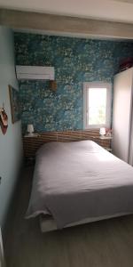 Postel nebo postele na pokoji v ubytování Maison chaleureuse, vue mer avec belle terrasse,