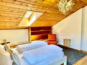 Posteľ alebo postele v izbe v ubytovaní Chalet Bernardi Apartments