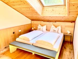 Posteľ alebo postele v izbe v ubytovaní Chalet Bernardi Apartments
