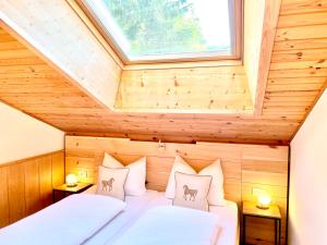Posteľ alebo postele v izbe v ubytovaní Chalet Bernardi Apartments