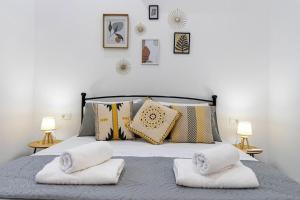 a bedroom with a bed with two pillows on it at Nikolias dream house in Ialysos