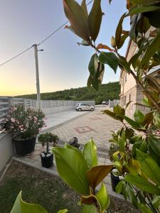 a car parked in a parking lot with plants at Spacious villa for 10 with a big private pool in Trilj