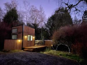 a tiny house in the middle of a forest at Tiny House in the Bush - a minute from town centre in Raetihi