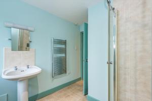 a bathroom with a sink and a shower at The Queens in Carlisle