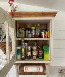 a cupboard filled with lots of food and spices at Hideaway in the Hills in Church Stretton