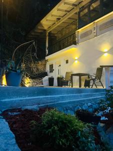 a house with a pool at night at Apartment Ana in Arzl im Pitztal