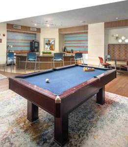 a pool table in a living room with at Houston Texas 1BR APT With pool view near NRG and MED CENTER in Houston
