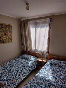 Postel nebo postele na pokoji v ubytování Céntrico departamento a pasos del lago