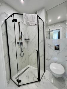 Koupelna v ubytování Apartament Premium 214 Planeta Mielno - balkon, klimatyzacja, 100 m od plaży + 13 fotografií