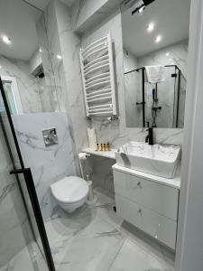 Koupelna v ubytování Apartament Premium 214 Planeta Mielno - balkon, klimatyzacja, 100 m od plaży