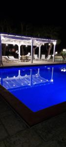 a boat with a blue deck at night at Hotel Villa Elisabetta in Galatina